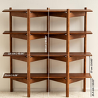 Wooden bookshelf with measurements on a neutral background